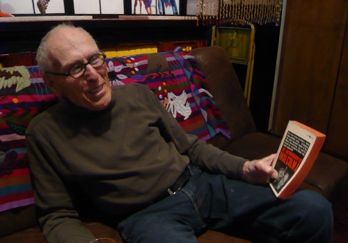 Barney Rosset with 'The Autobiography of Malcolm X'